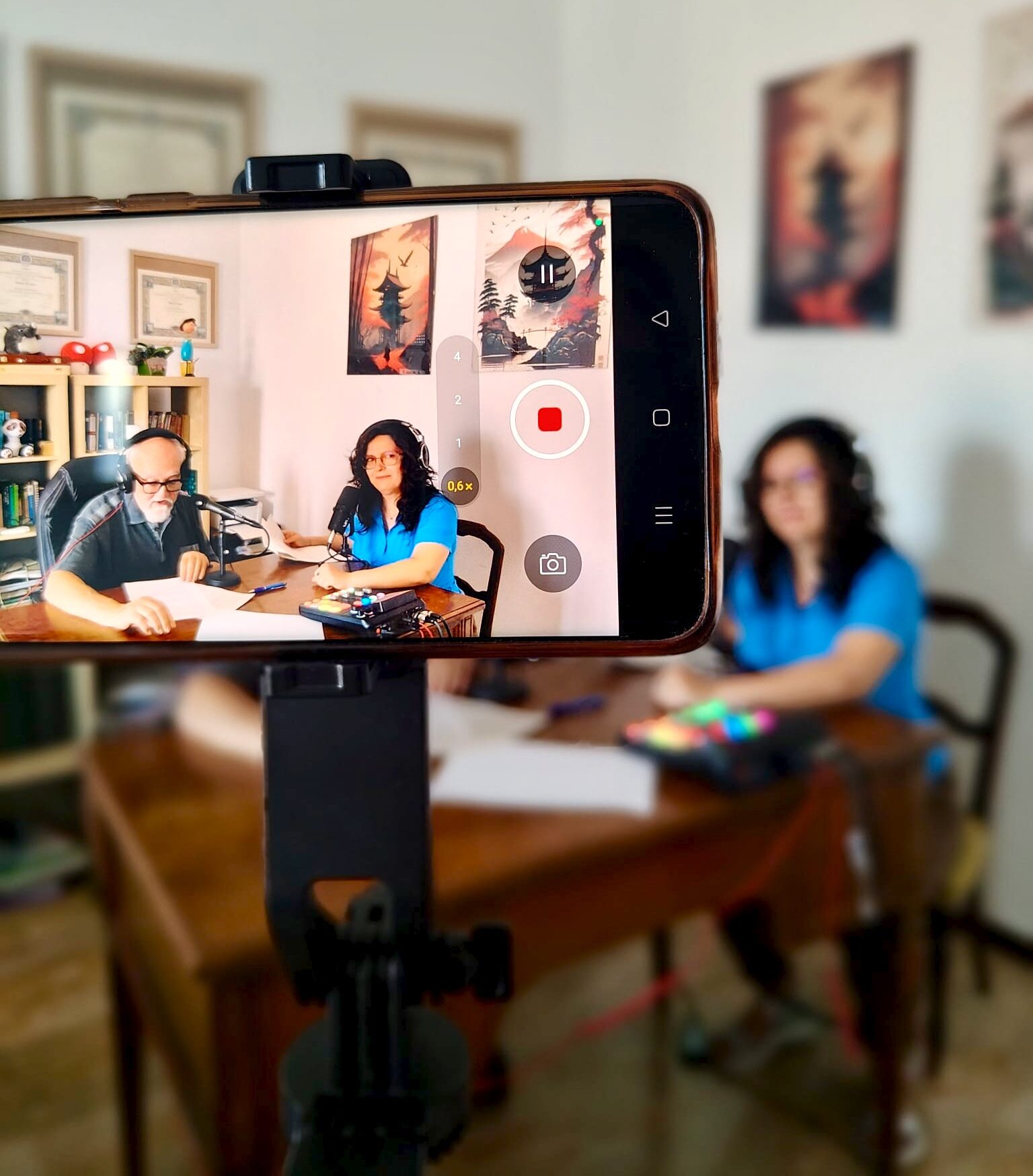 Mirela and Tony behind the scenes during a podcast recording